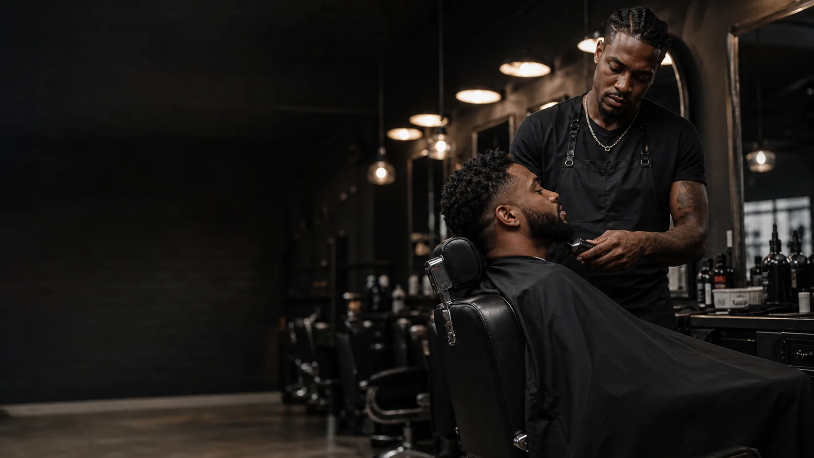 A Cutline barber lining up a client's beard in a dark, modern barbershop